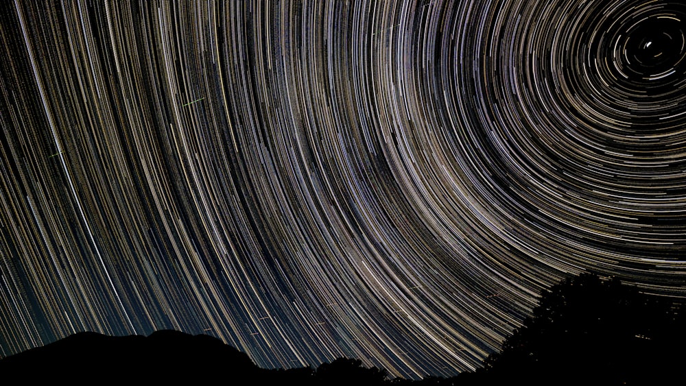 a star trail is seen in the night sky