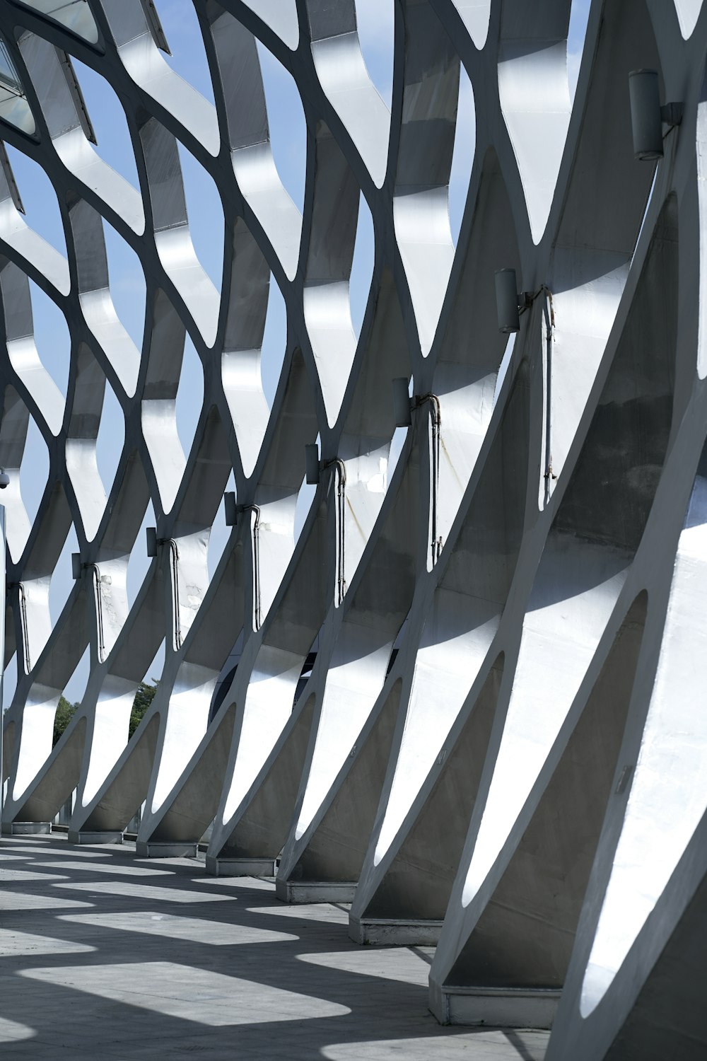 a large metal structure with a sky in the background