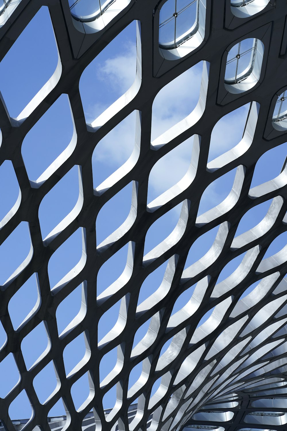 a large metal structure with a clock on each of it's sides