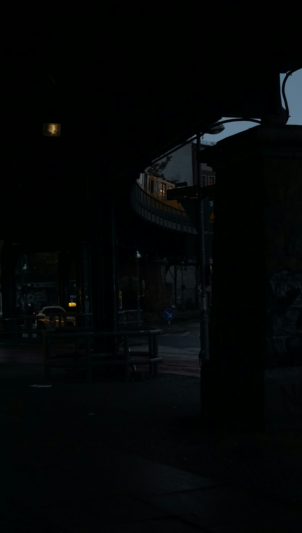 a person riding a skateboard on a city street at night