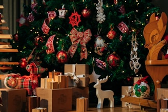 a christmas tree with presents under it