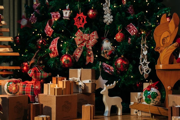 a christmas tree with presents under it