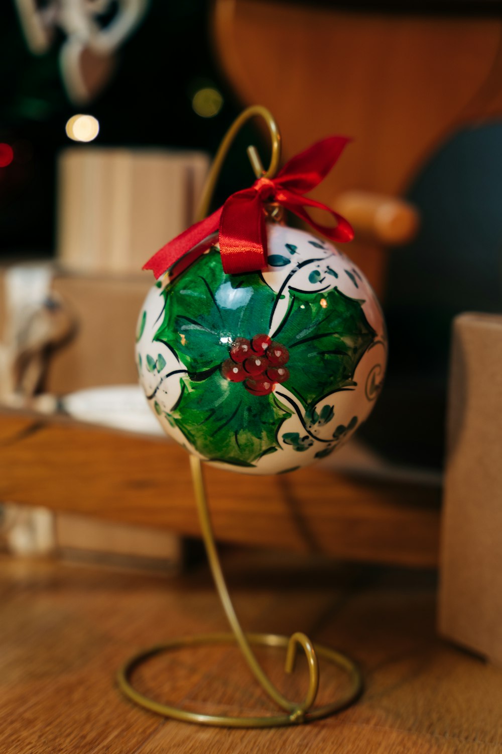 a christmas ornament on a stand on a table