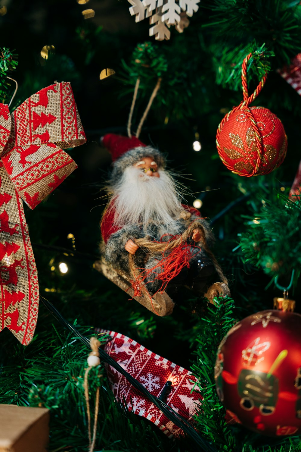 a christmas tree with ornaments and a santa clause ornament