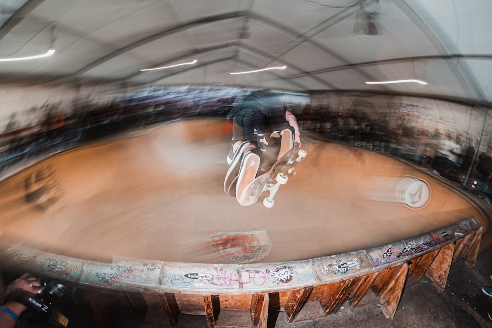 a man riding a skateboard up the side of a ramp