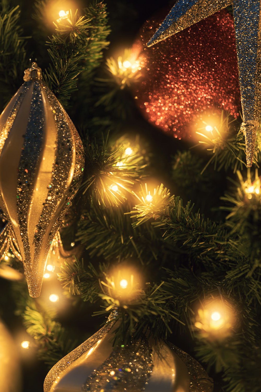 a close up of a christmas tree with ornaments