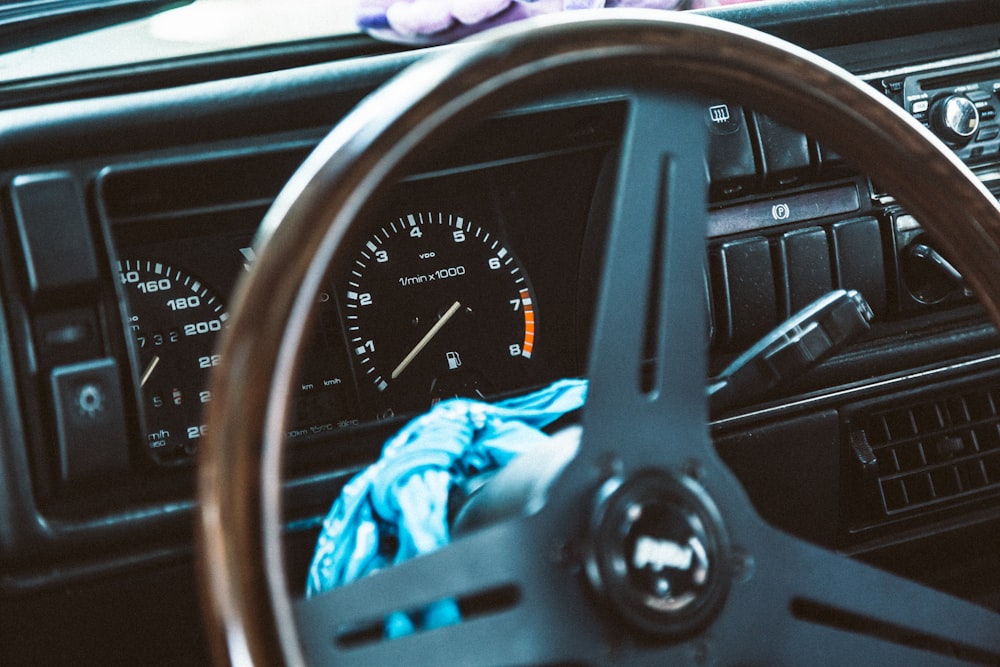 a steering wheel and dashboard of a car