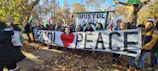 Volunteers handing out peace-themed flyers on a bustling street corner in Delaware.