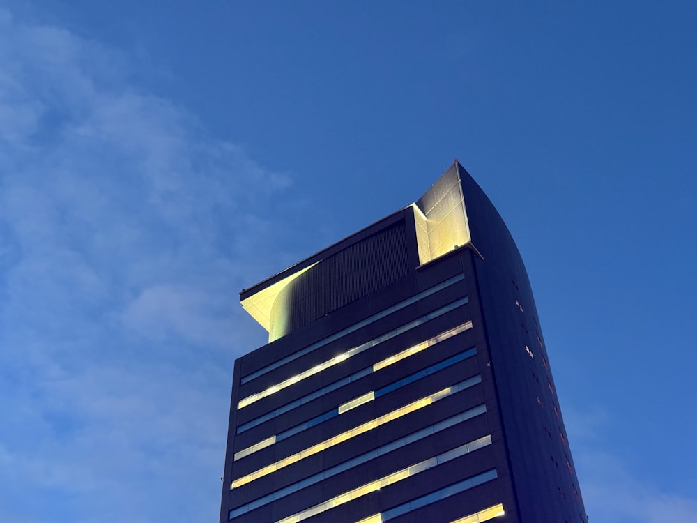 a very tall building with a sky in the background