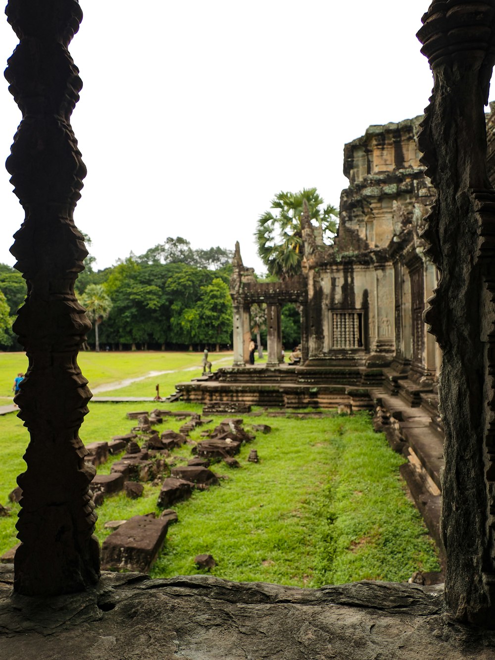 a view of the ruins of a temple through a window