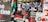 A large group of people demonstrating with banners and placards advocating for Palestine. The signs are prominently displaying slogans like 'Free Palestine' and have a mix of English and Arabic text. Several Palestinian flags are visible among the crowd.