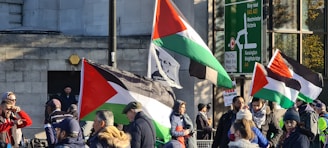 A vibrant community meeting in Palestina discussing local development plans.