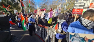 A group photo of supporters holding banners with 'Vote Ballot No. 36' at a community gathering.