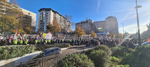 Security personnel managing crowd control at a large event.
