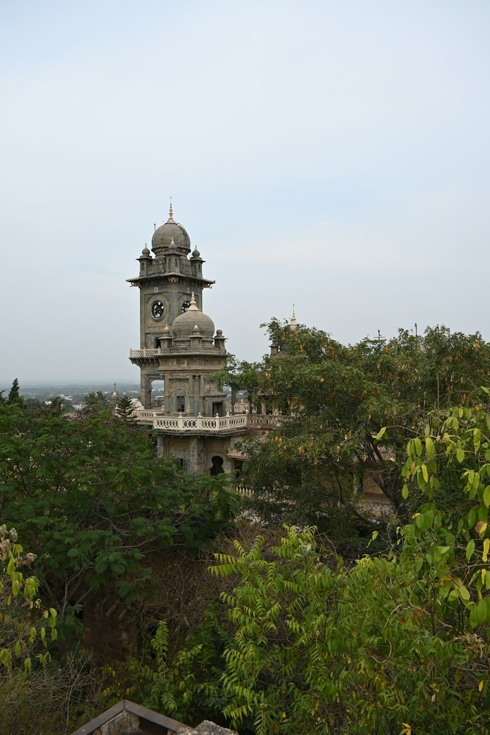 a tall tower with a clock on the top of it