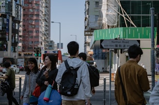 A busy Hong Kong street scene near Fa Yuen Street, with electronics shops and bustling crowds.