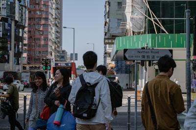 A busy Hong Kong street scene near Fa Yuen Street, with electronics shops and bustling crowds.