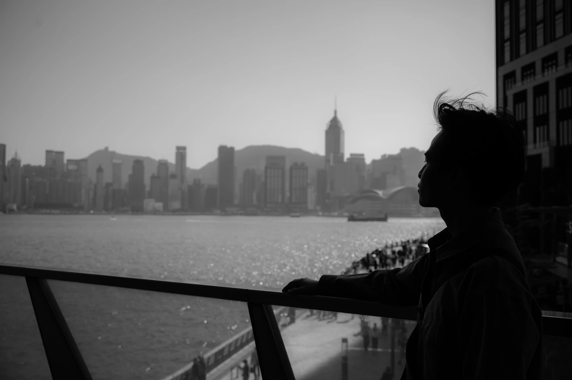 a man looking out over a body of water
