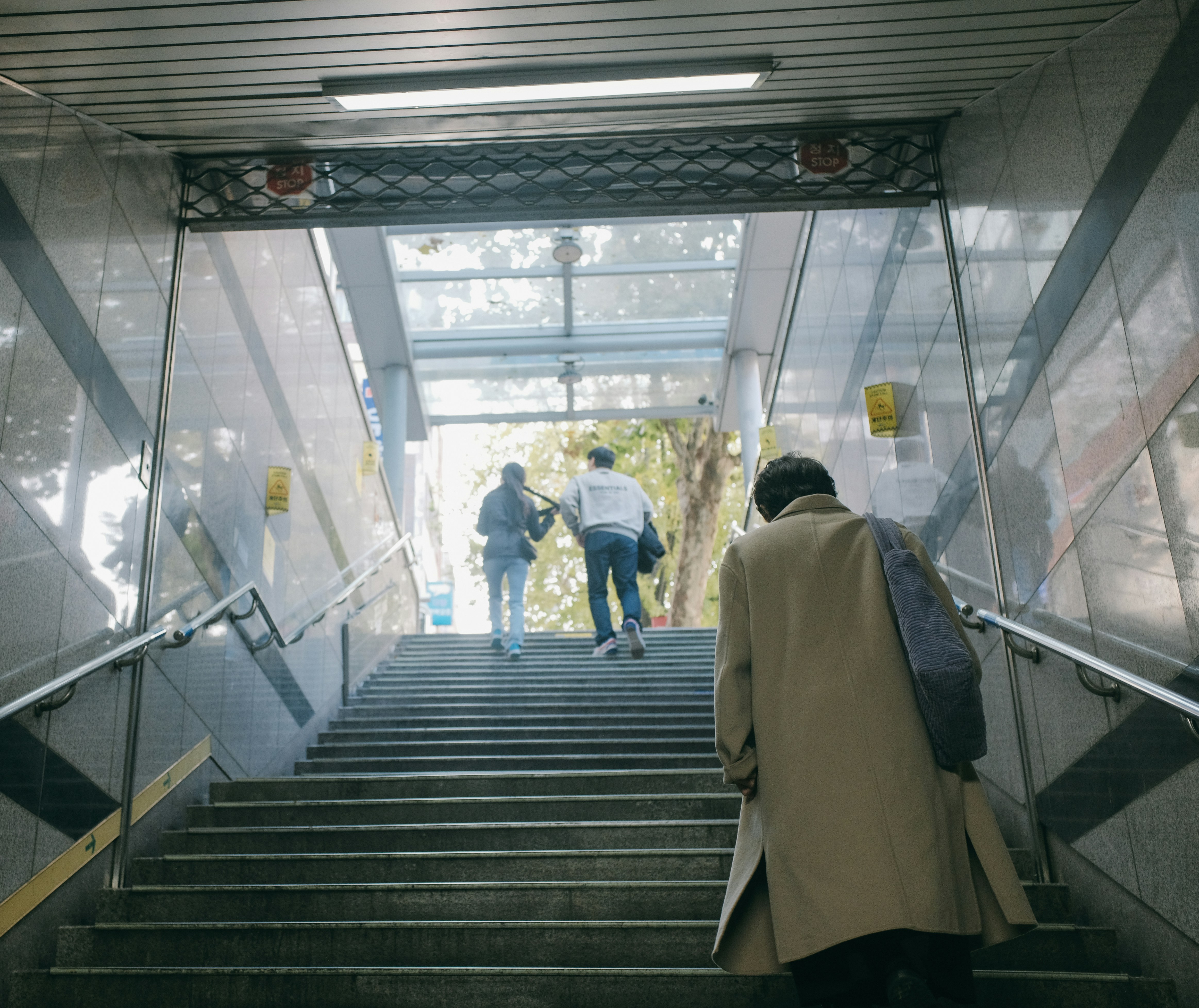 two people walking up a flight of stairs