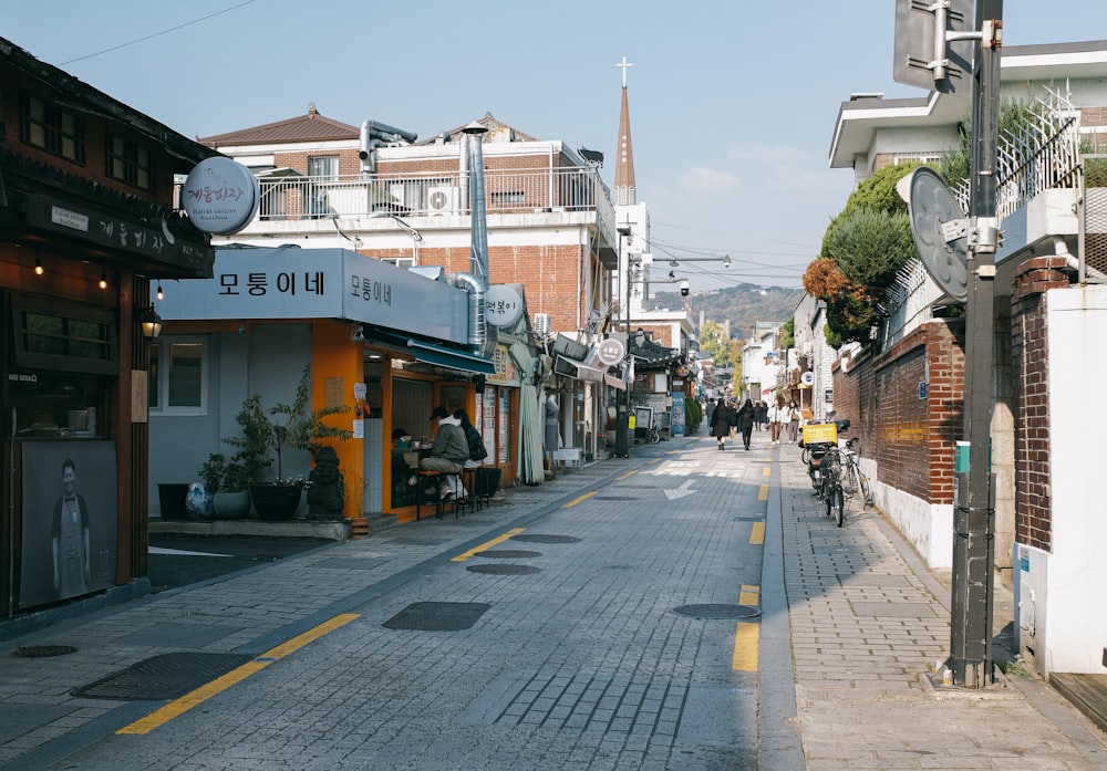 a city street lined with buildings and shops