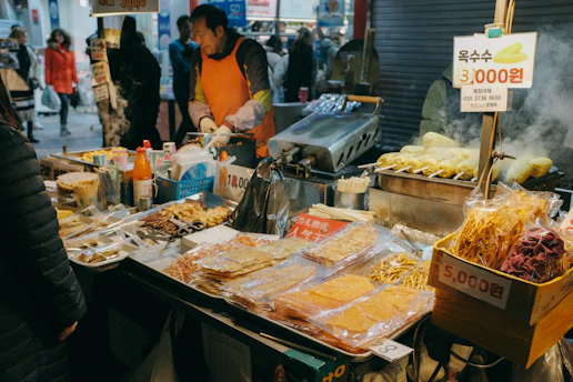 A vibrant street food stall in Banten bustling with locals enjoying traditional snacks.