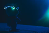 Helmet Bro character standing proudly with a glowing blue and gold background.