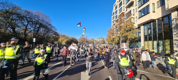 Volunteers handing out leaflets about democracy and responsibility on a sunny city street.