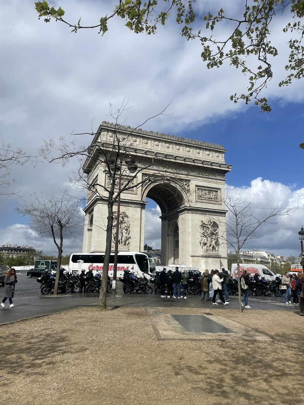 a group of people standing in front of a monument