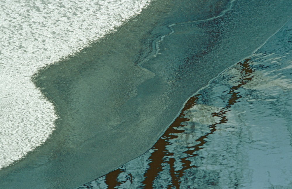 an aerial view of a beach and water