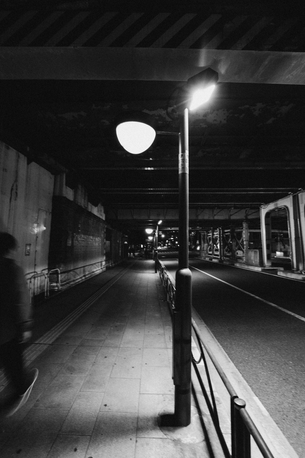 a black and white photo of a subway station