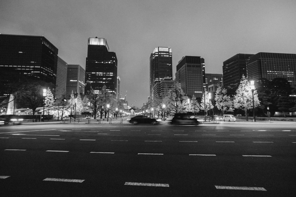 a black and white photo of a city at night