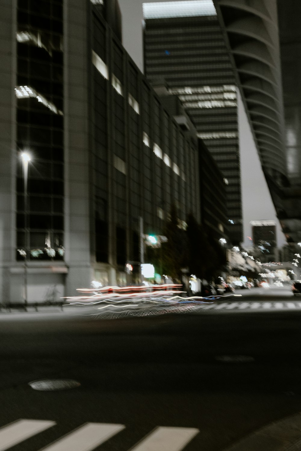 a blurry photo of a city street at night