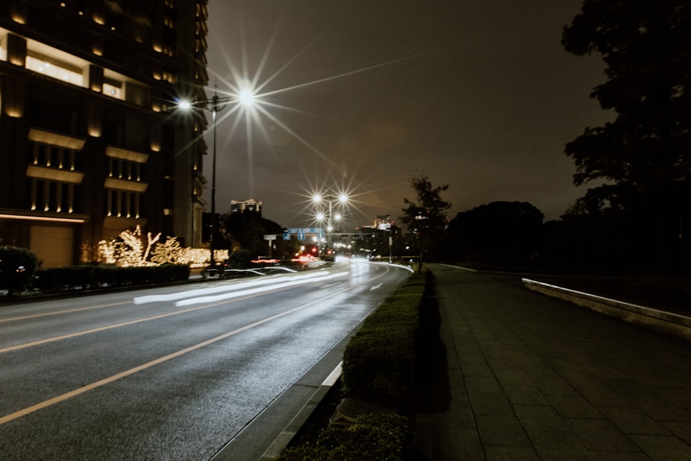 a city street at night with street lights