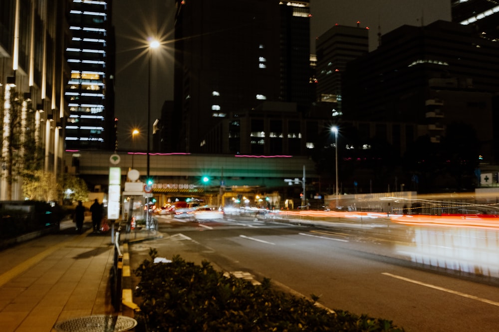 a city street at night with a lot of traffic