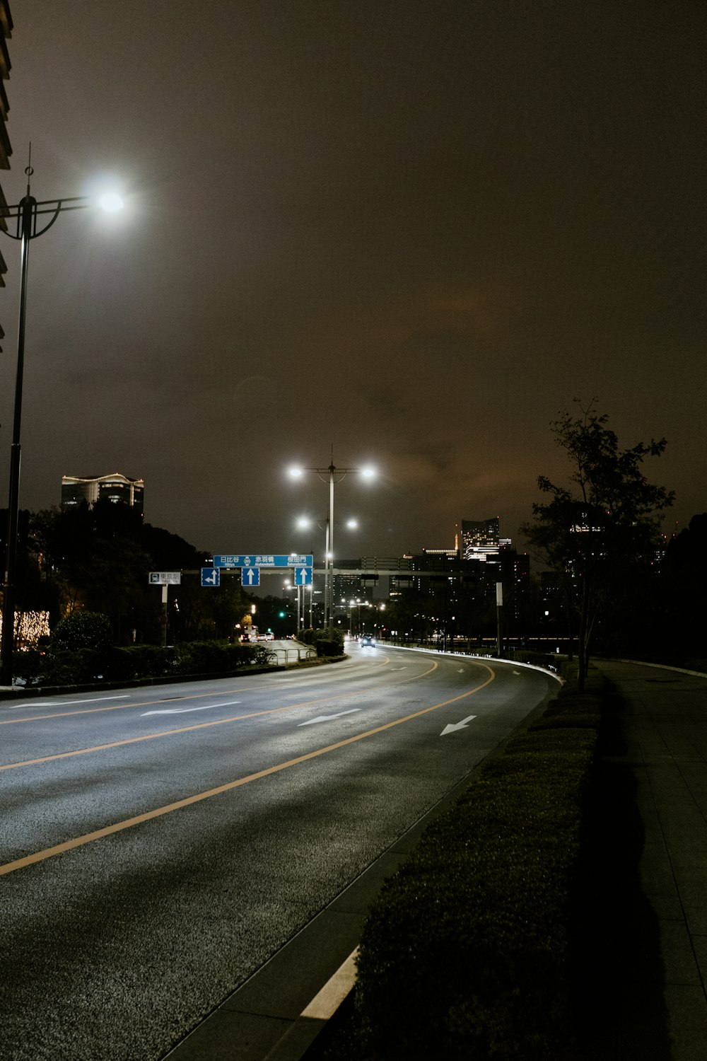 a city street at night with street lights