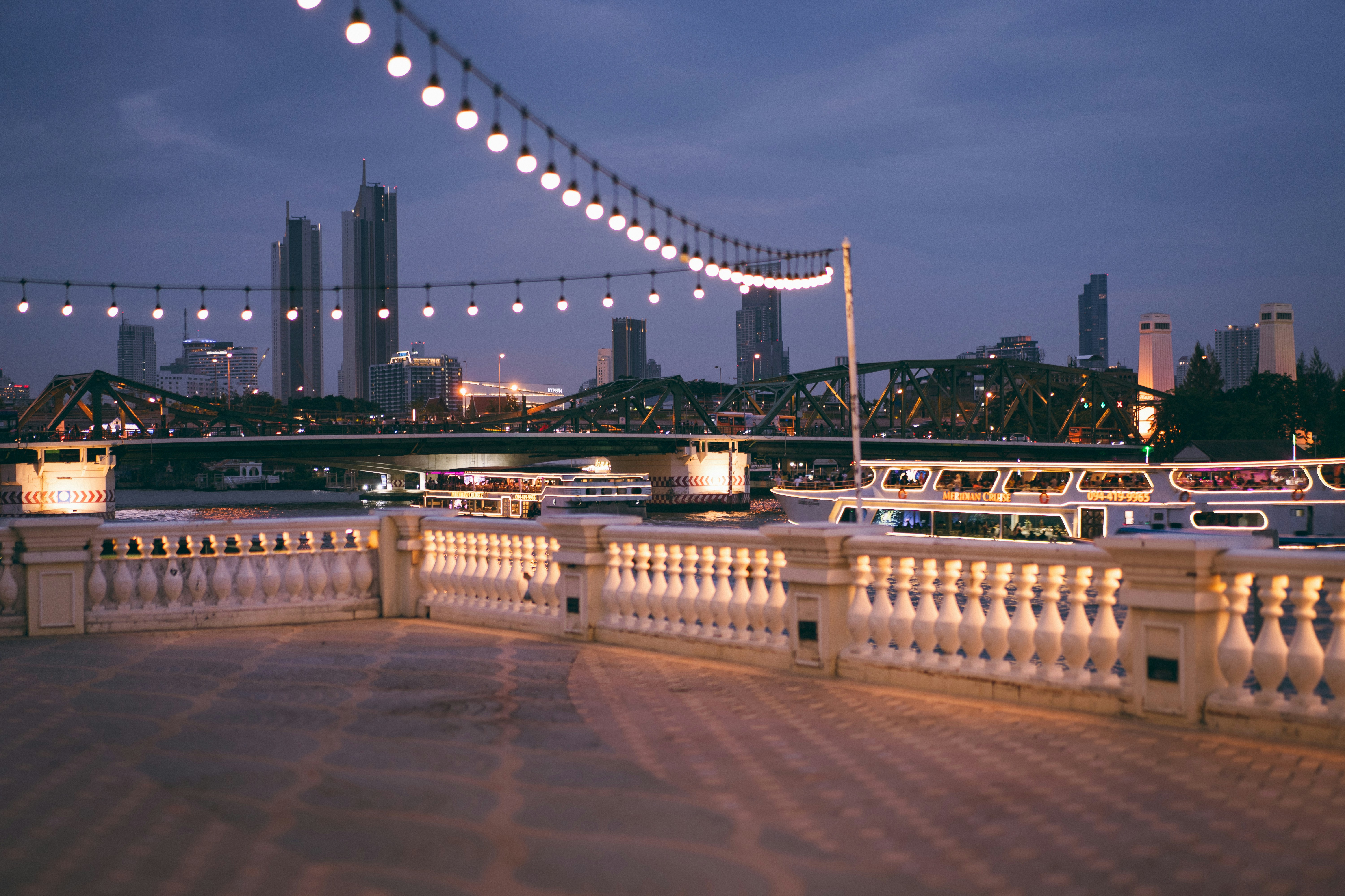 a bridge that has a bunch of boats on it