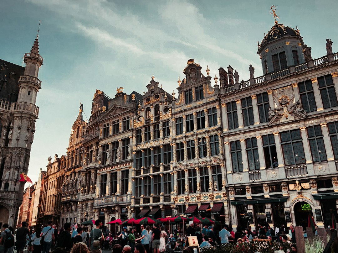 a group of people standing in front of a building,