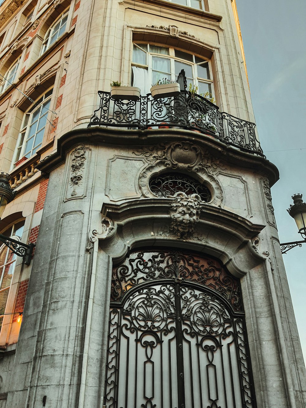 a tall building with a wrought iron gate