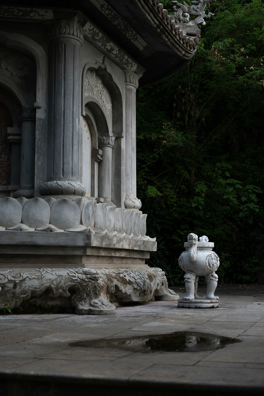 a white fire hydrant sitting in front of a building