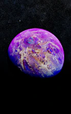 A high-resolution image of a vibrant exoplanet orbiting a bright star in deep space.