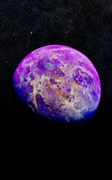 a purple and blue object floating in the air
