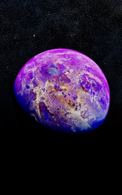 A glowing purple planet with stars twinkling in a dark blue space background.