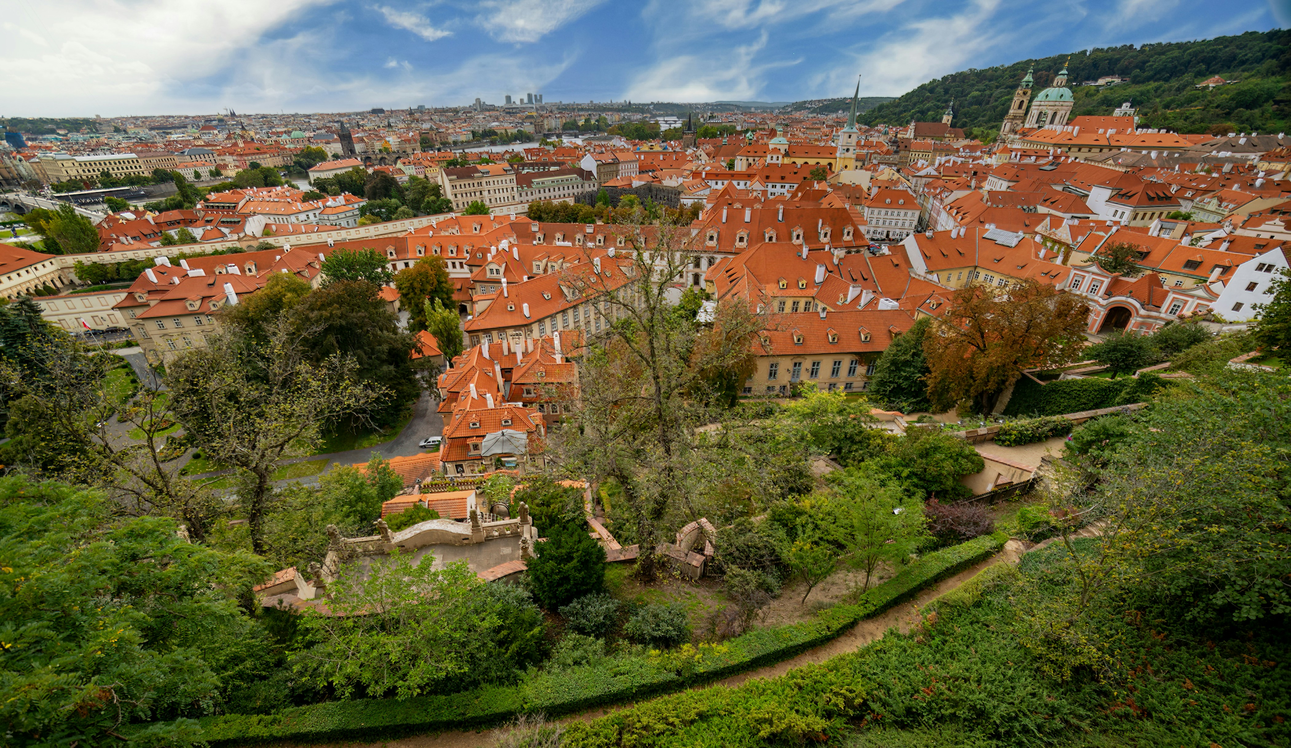 an aerial view of a city with red roofs
