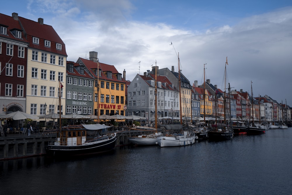 a row of buildings next to a body of water