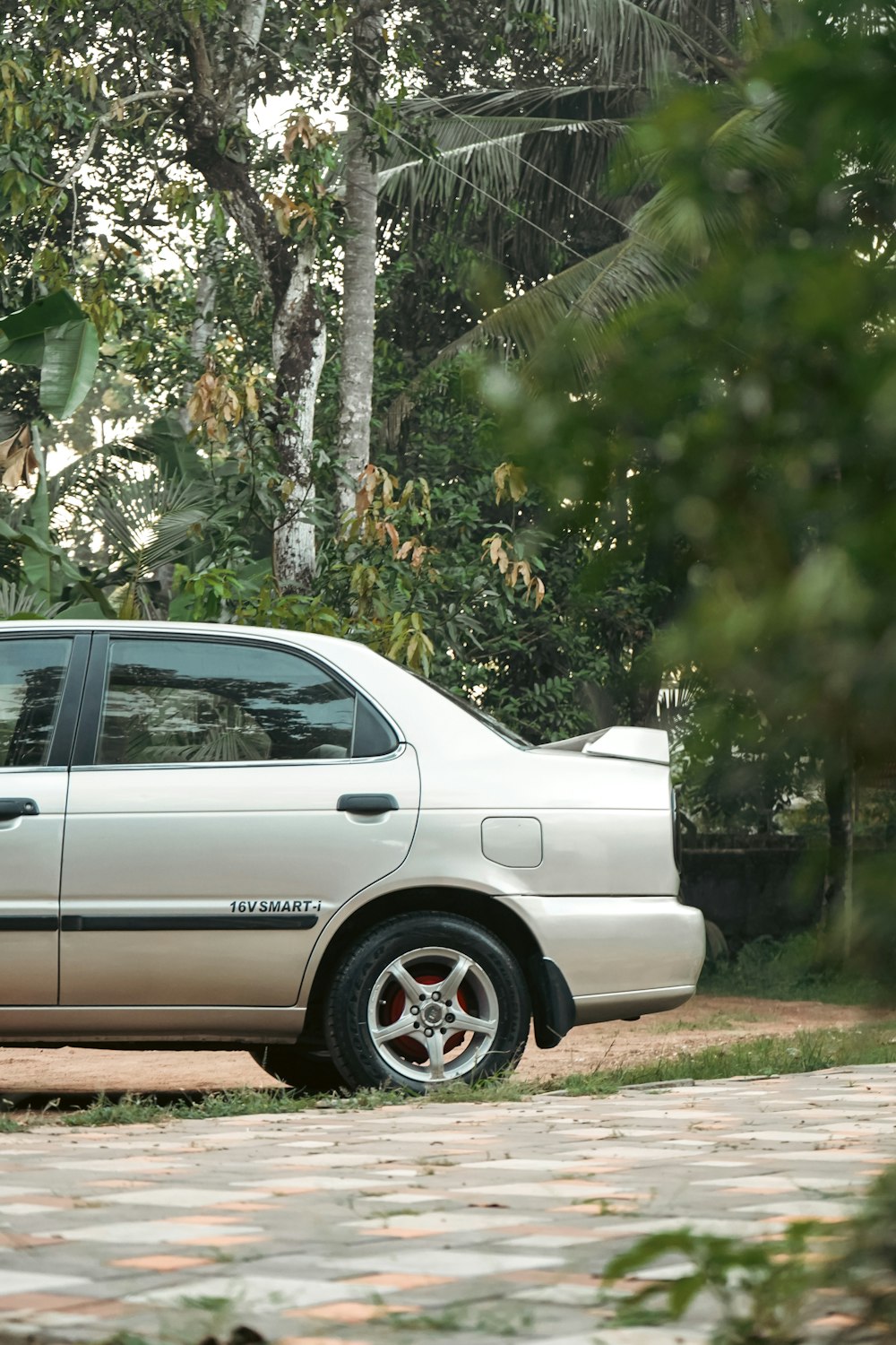 a white car parked on the side of a road