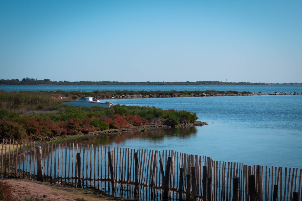 a body of water with a boat in the distance