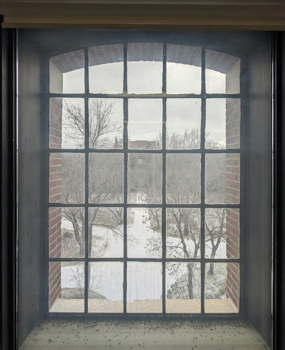 a window with a view of a snowy landscape