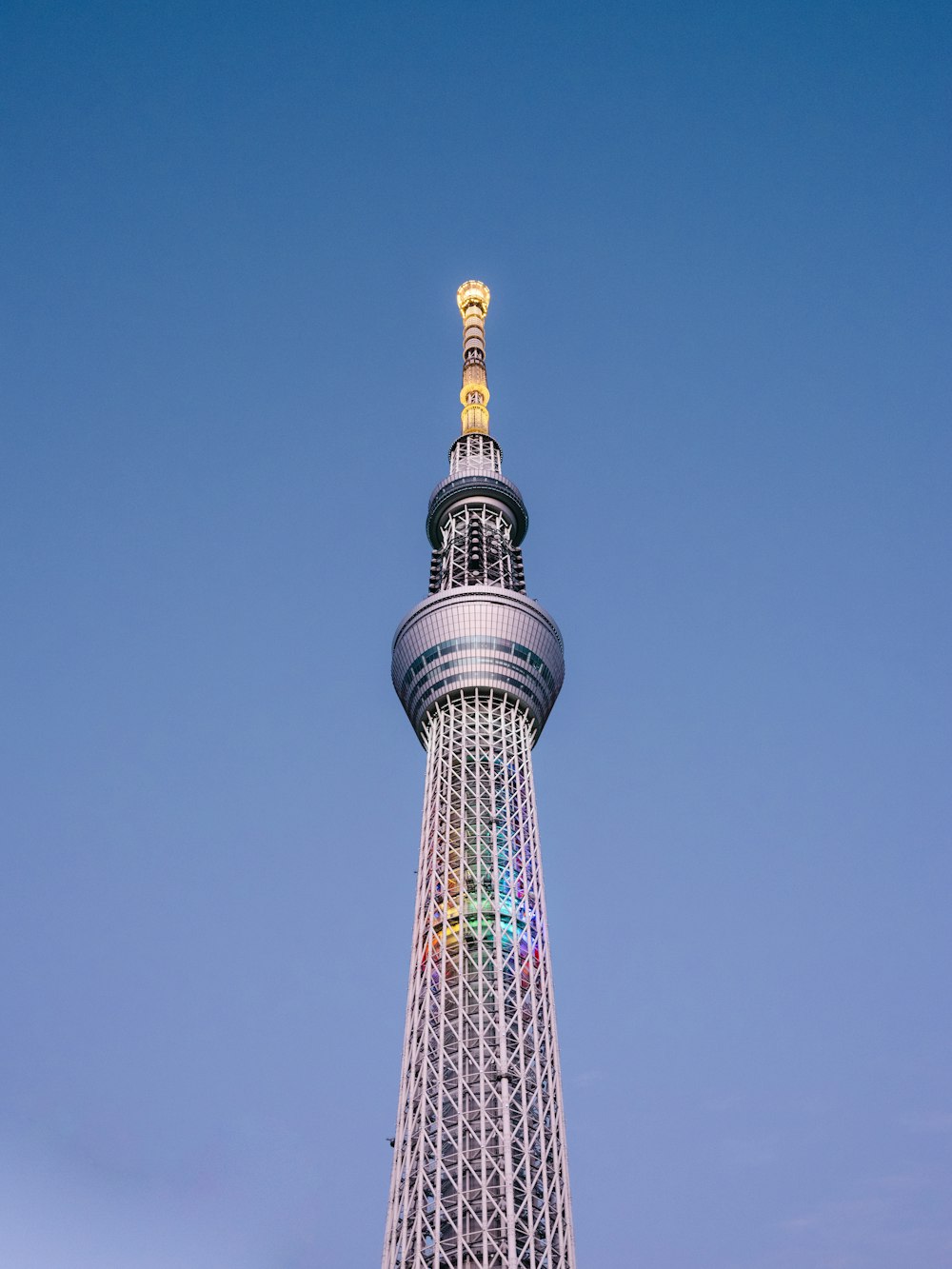 a very tall tower with a clock on it's side