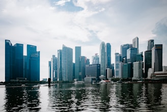 a large body of water with a city in the background