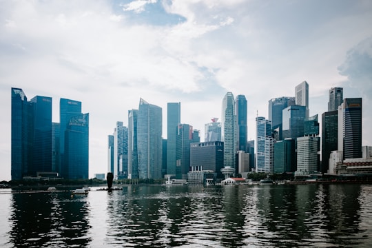 a large body of water with a city in the background